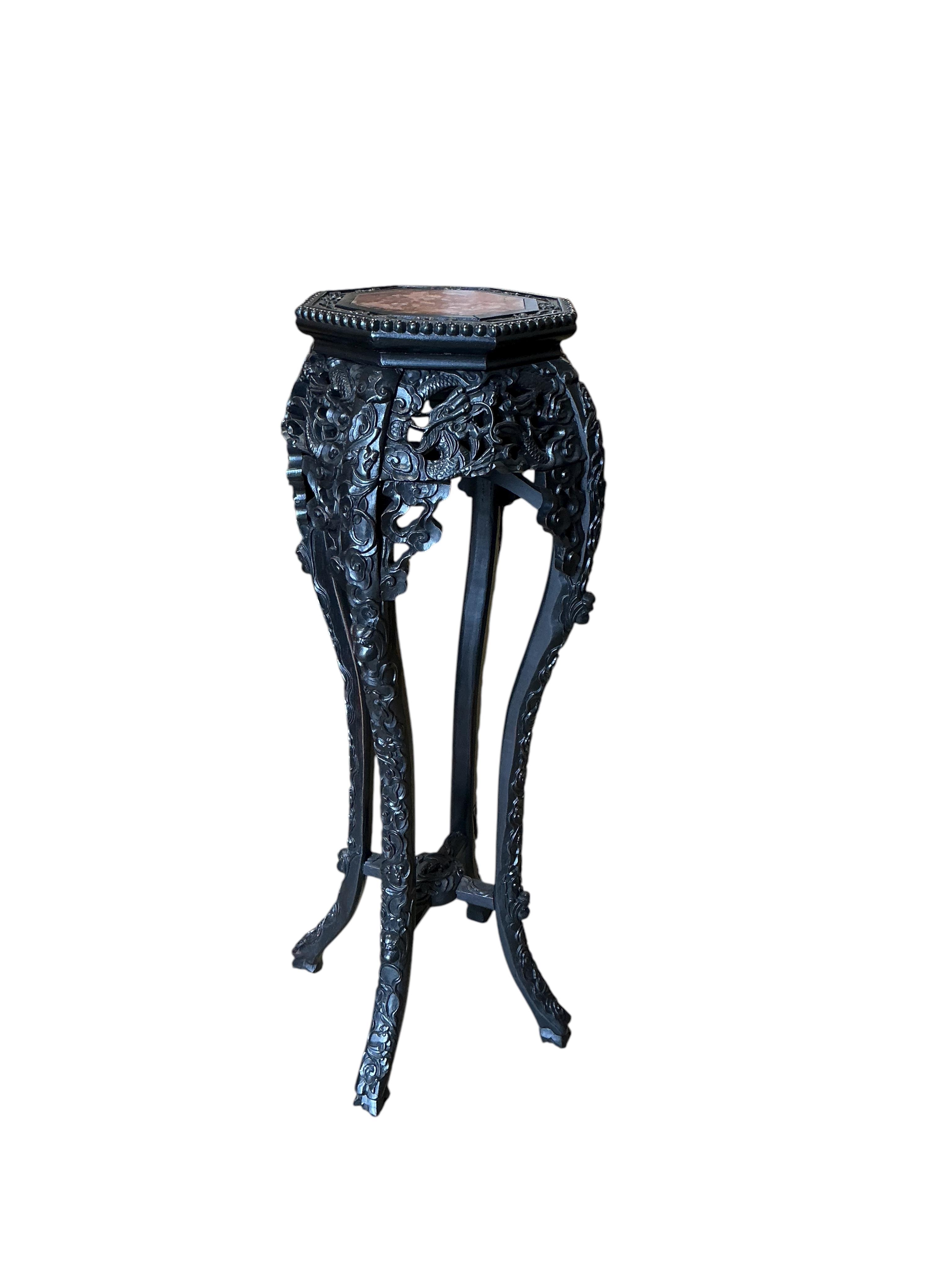 A Chinese octagonal marble topped vase stand, width 32cm, height 91cm